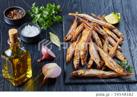 cold smoked smelts on a black slate 59548382