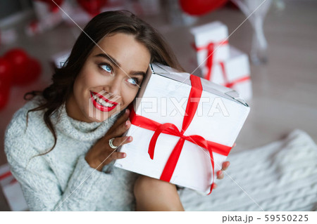 Attractive beautiful and sexy woman with perfect smile and teeth. With makeup at birthday or 59550225