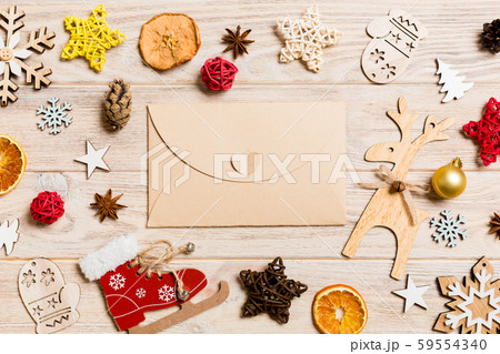 Top view of envelope on festive wooden background. Top view of envelope on festive wooden background. 59554340