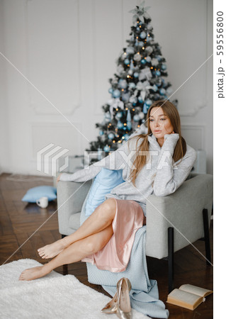 christmas, x-mas, winter, happiness concept - smiling woman with many gift boxes. Girl opens a gift christmas, x-mas, winter, happiness concept - smiling woman with many gift boxes. Girl opens a gift 59556800