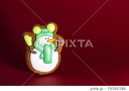 gingerbread cookie of cute snowman on red 59560386