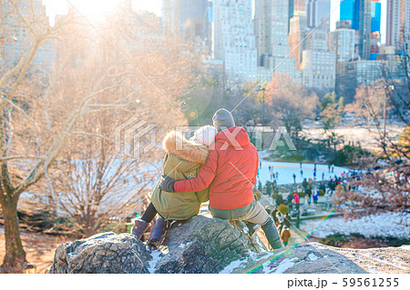 Happy couple enjoy the view of famous ice-rink in Central Park in New York City 59561255