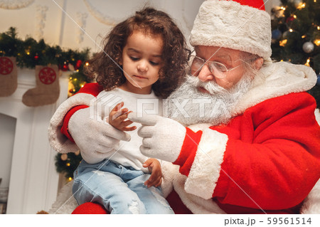 Santa Claus with kids indoors christmas celebration concept 59561514