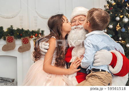 Santa Claus with kids indoors christmas celebration concept 59561518