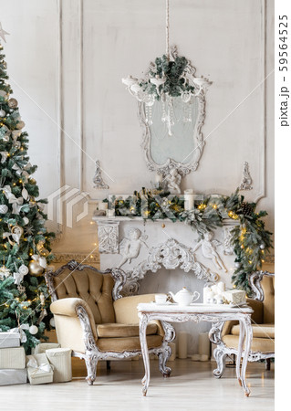 Christmas morning. Classic luxury apartments with a white fireplace, christmas tree, sofa, large 59564525