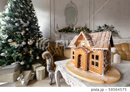 Gingerbread house, concept holiday of Christmas and Happy new year. Defocused lights of Christmas 59564575