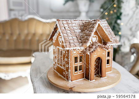 Gingerbread house, concept holiday of Christmas and Happy new year. Defocused lights of Christmas 59564578