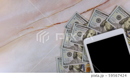 Digital tablet with screen in over cash money Digital tablet with screen in over cash money 59567424