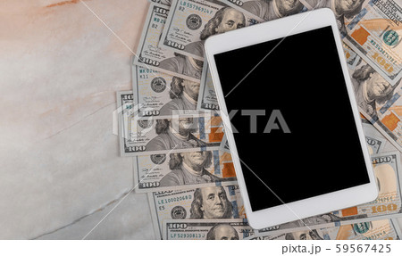 Dollar bills and digital devices tablet with 59567425
