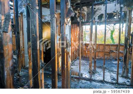 Burned house interior after fire burnt black 59567439