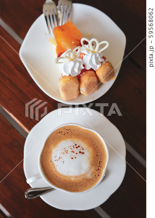 espresso hot coffee drink and orange cake put on breakfast table in the morning espresso hot coffee drink and orange cake put on breakfast table in the morning 59568062