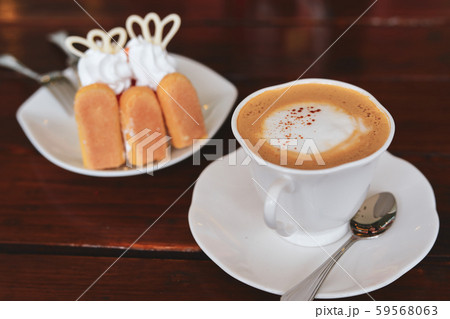 espresso hot coffee drink and orange cake put on breakfast table in the morning espresso hot coffee drink and orange cake put on breakfast table in the morning 59568063