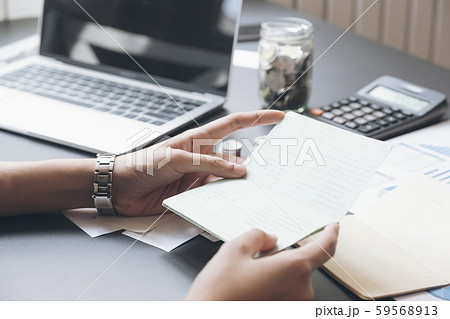 Accountant hands holding saving account passbook, Accountant hands holding saving account passbook, 59568913