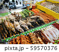Freshly made marine products, seafood, fish and meat on the shelves of a street vendor kiosk, Phuket, Thailand 59570376