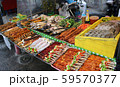 Freshly made marine products, seafood, fish and meat on the shelves of a street vendor kiosk, Phuket, Thailand 59570377