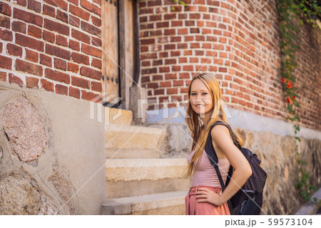 Young woman tourist in Bukchon Hanok Village is one of the famous place for Korean traditional Young woman tourist in Bukchon Hanok Village is one of the famous place for Korean traditional 59573104