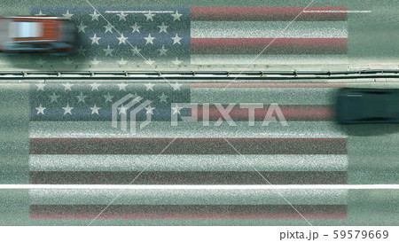 Aerial top down view of cars and flag of the United States on the road. Traveling related conceptual Aerial top down view of cars and flag of the United States on the road. Traveling related conceptual 59579669