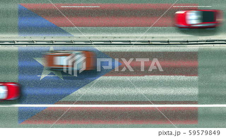 Aerial top down view of cars and flag of Puerto Rico on the road. Traveling related conceptual 3D 59579849