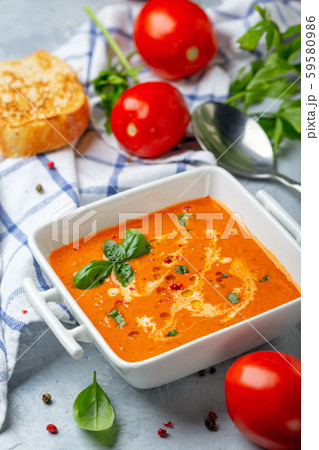 Spicy tomato soup with green basil. Spicy tomato soup with green basil. 59580986