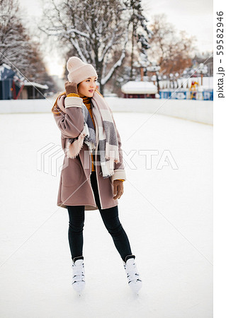 Cute and beautiful girl in a winter city Cute and beautiful girl in a winter city 59582946