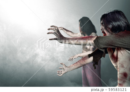 Two scary zombies with blood and wound on his body Two scary zombies with blood and wound on his body 59583121