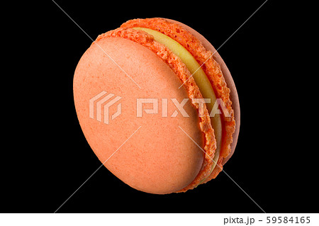 Macro photo of french orange rose macaroon isolated on black with clipping path 59584165