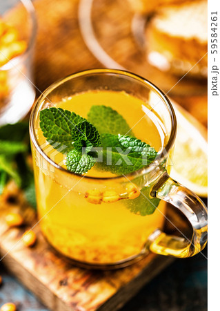 Sea buckthorn tea. Hot healing berry drink for the Sea buckthorn tea. Hot healing berry drink for the 59584261