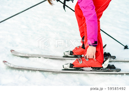 Sport set of skis, boots and sticks in red on Sport set of skis, boots and sticks in red on 59585492