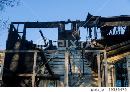 House after a fire view of a burnt building House after a fire view of a burnt building 59586476