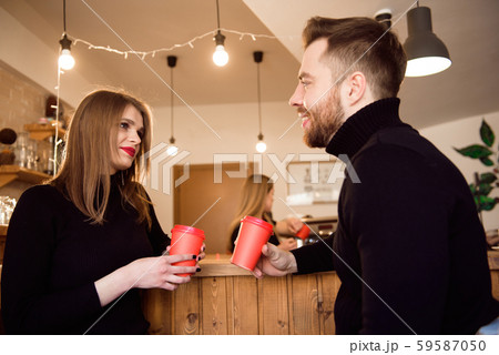 Young attractive couple on date in coffee shop. Young attractive couple on date in coffee shop. 59587050