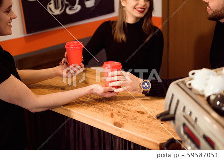 Young attractive couple on date in coffee shop. 59587051