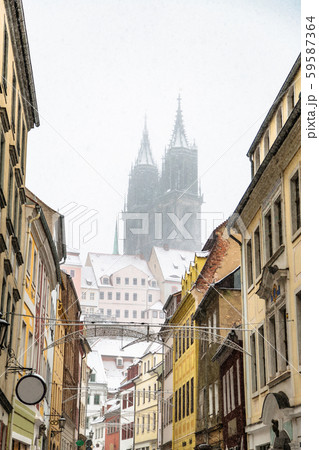 Snowy street in historic city of Meissen in winter 59587364