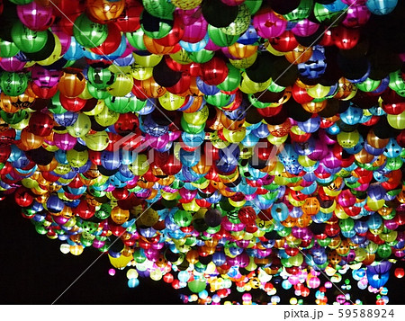 selective focus on hand painted paper ball lanterns along main entrance street of KHON KAEN university in KHONKAEN province, THAILAND on nighttime showing unique decorative style LOIKRATHONG festival 59588924