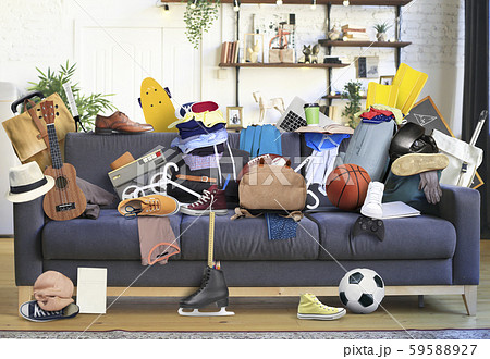 Large leather sofa with a bunch of different things	 59588927