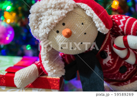 Christmas presents under the tree.Christmas gifts for whole family.Snowman Plush Toy Christmas presents under the tree.Christmas gifts for whole family.Snowman Plush Toy 59589269