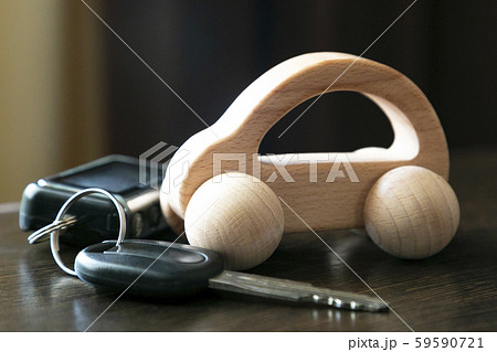 Car keys on a background of a wooden car. 59590721