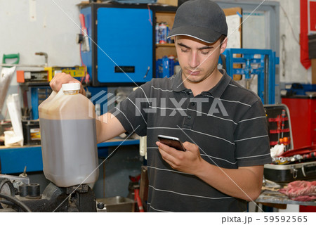 Portrait of a young mechanic in his workshop Portrait of a young mechanic in his workshop 59592565
