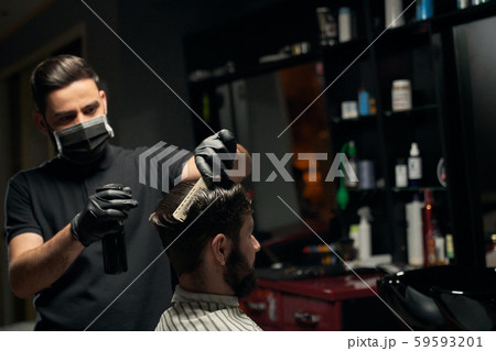 Professional male hairdresser making new haircut for client 59593201