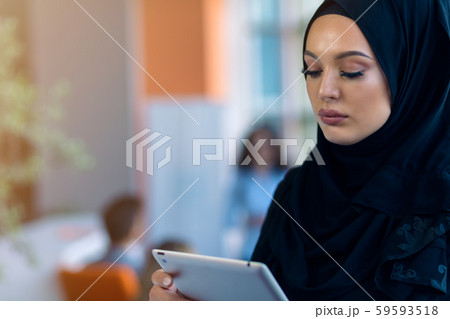 pretty modern Arabian woman with tablet computer 59593518