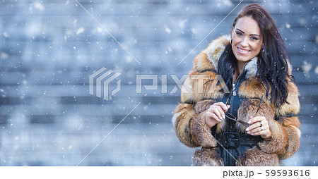 Winter portrait of attractive young woman in warm Winter portrait of attractive young woman in warm 59593616