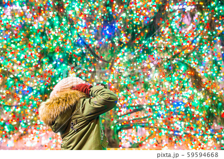 Happy girl on the background of the Rockefeller Christmas tree in New York Happy girl on the background of the Rockefeller Christmas tree in New York 59594668