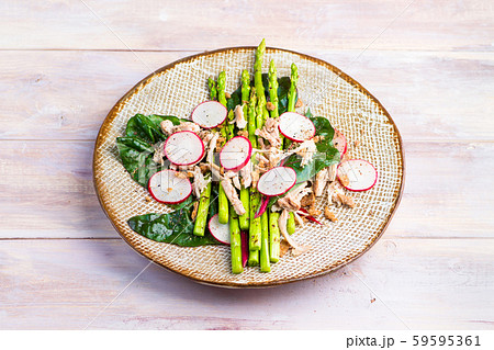 Asparagus salad with chicken, radish, beet leafs and rye crumb 59595361