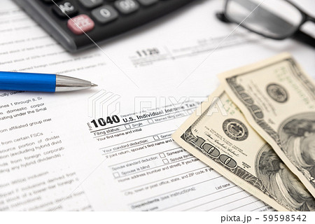 US tax form on desk composition 59598542