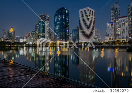 BANGKOK, THAILAND - 7 Nov 2019 :Reflection office building water front a Benjakiti green park BANGKOK, THAILAND - 7 Nov 2019 :Reflection office building water front a Benjakiti green park 59599079