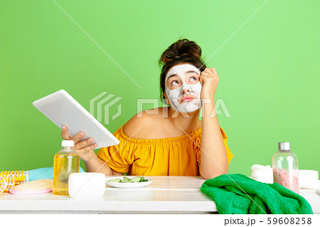 Portrait of young caucasian woman in her beauty day and skin care routine Portrait of young caucasian woman in her beauty day and skin care routine 59608258