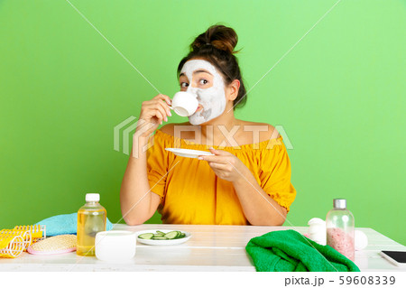 Portrait of young caucasian woman in her beauty day and skin care routine Portrait of young caucasian woman in her beauty day and skin care routine 59608339