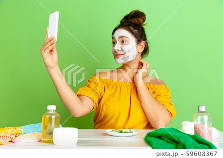 Portrait of young caucasian woman in her beauty day and skin care routine 59608367