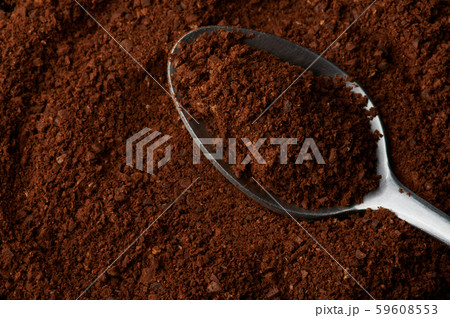 Milled fresh coffee in spoon Milled fresh coffee in spoon 59608553