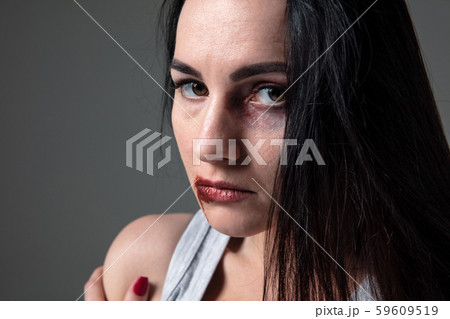 Woman in fear of domestic abuse and violence, concept of female rights Woman in fear of domestic abuse and violence, concept of female rights 59609519