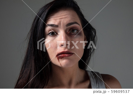 Woman in fear of domestic abuse and violence, concept of female rights 59609537